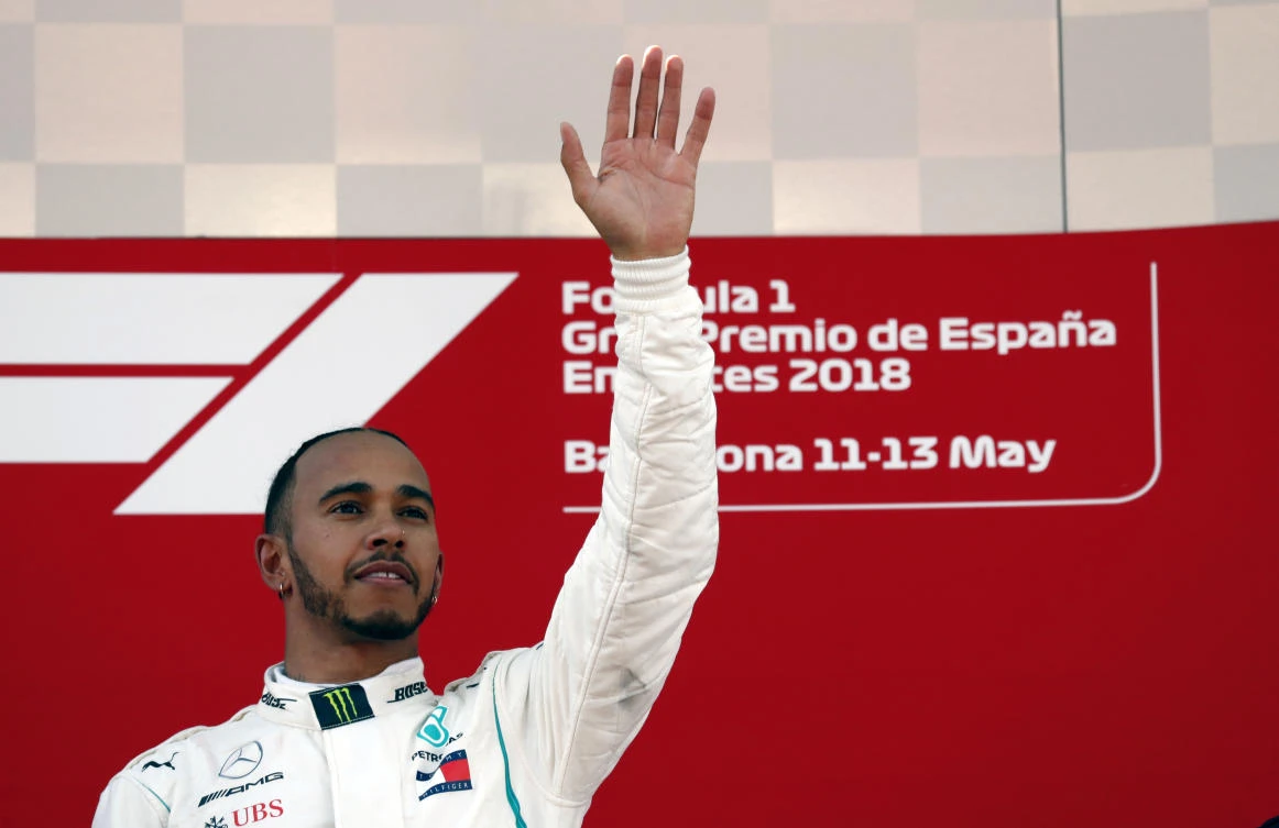 Mercedes driver Lewis Hamilton of Britain celebrates on the podium after winning the Spanish Formula One Grand Prix at the Barcelona Catalunya racetrack. (AP)