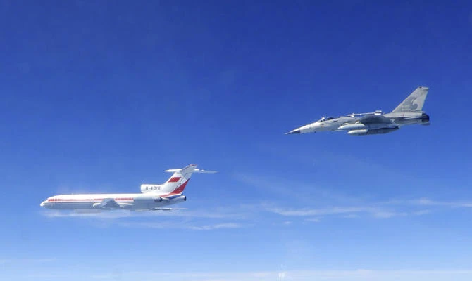 In this May 11, 2018 photo released by Taiwan's Ministry of National Defense, a Taiwanese Air Force Indigenous Defense Force (IDF) fighter aircraft, right, flies near a Chinese People's Liberation Army Air Force (PLAAF) TU-154 aircraft that reportedly flew over the Luzon Strait south of Taiwan during an exercise. (Ministry of National Defense via AP)