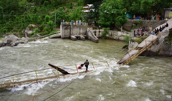 Pakistani rescuers search for missing university students after a bridge collapsed in Kundal Shahi, Neelum district on May 13, 2018. (AFP)