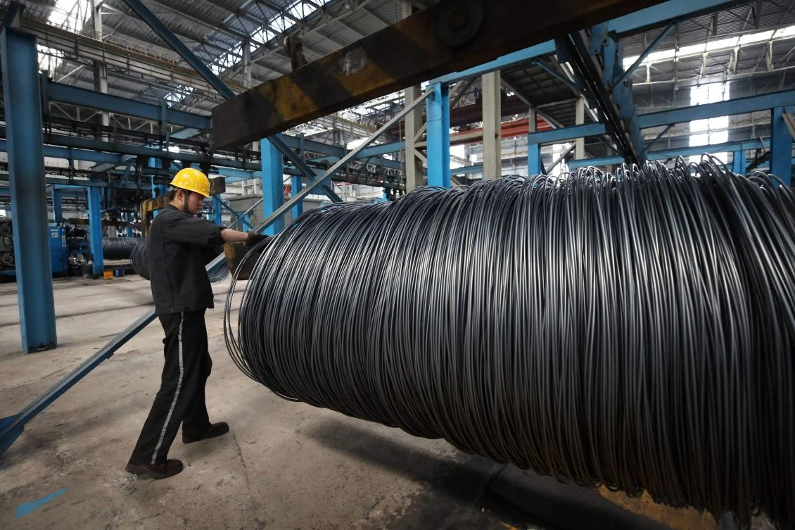 China’s industrial output jumps but sales slump