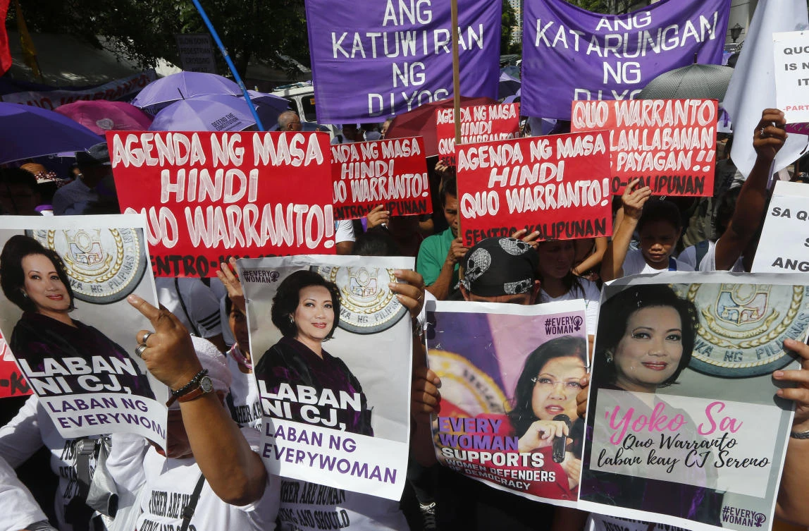 Protesters display placards as they mass in front of the Philippine Supreme Court to support Chief Justice Maria Lourdes Sereno, who was ousted on Friday, May 11. (AP)