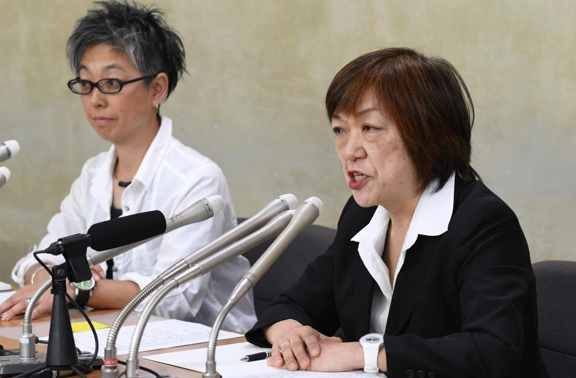 Yoshiko Hayashi, right, a freelancer who formerly worked at the mass-circulation Asahi Shimbun, said it was now ‘the time to eradicate sexual harassment and any other human rights infringement.’ (AFP)