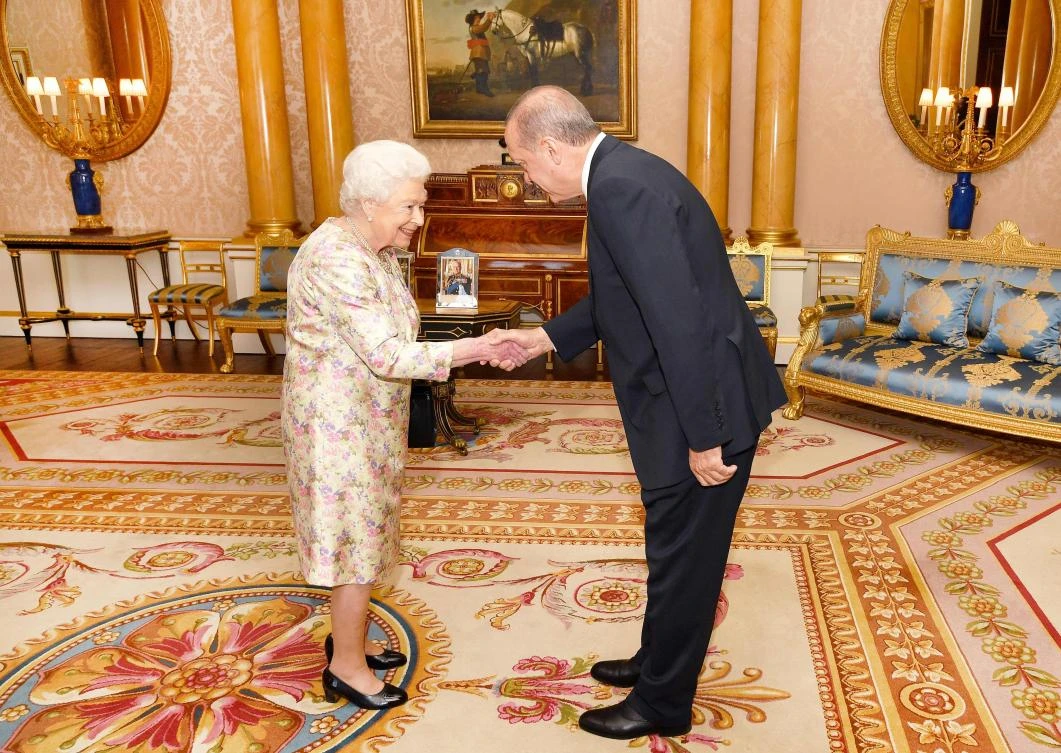 Britain's Queen Elizabeth II (L) greets Turkey's President Recep Tayyip Erdogan during a private audience at Buckingham Palace in London. (AFP)