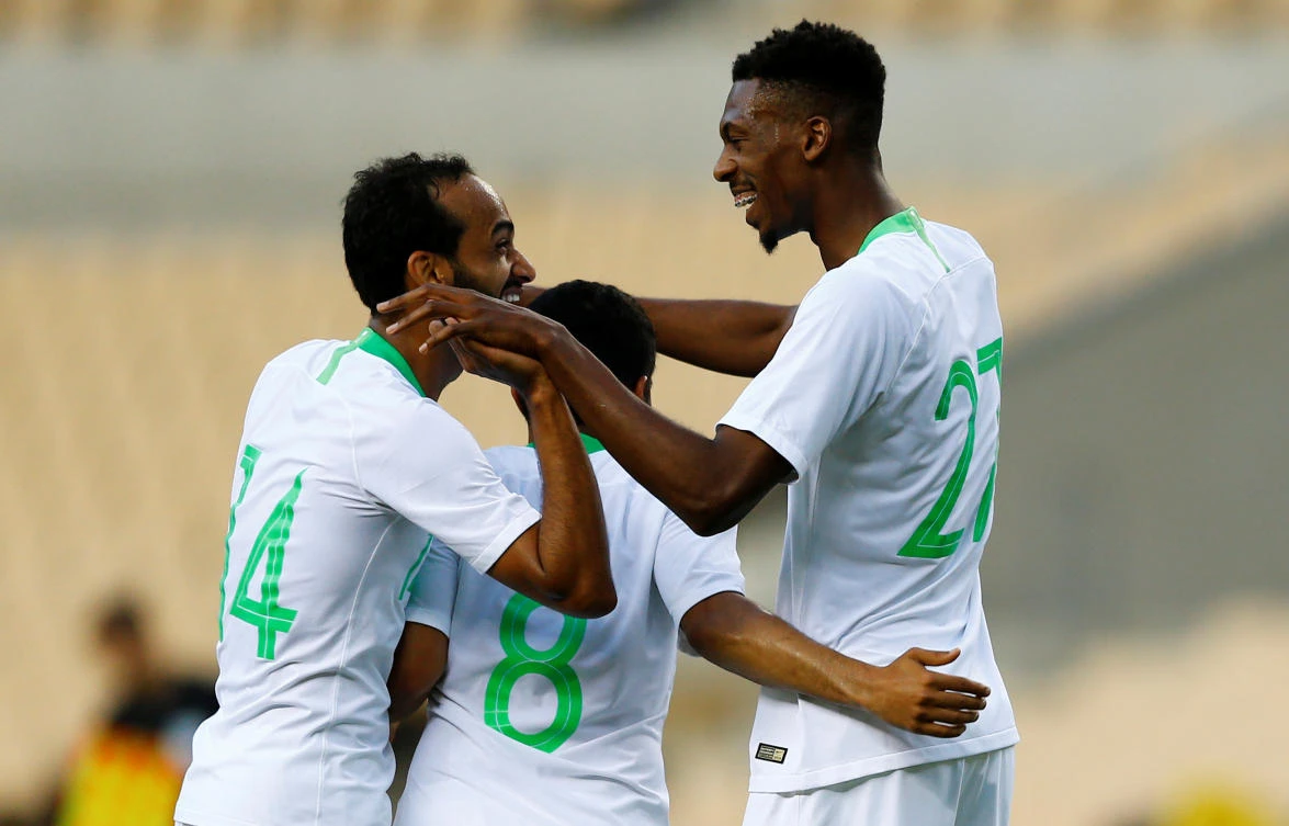 Saudi Arabia's Mohammed Kanno celebrates scoring their second goal against Greece with team mates. (REUTERS)