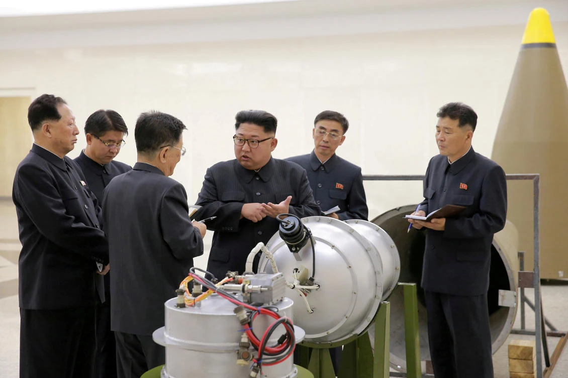 North Korean leader Kim Jong Un provides guidance with Ri Hong Sop, third left, and Hong Sung Mu, left, on a nuclear weapons program in this undated photo released by North Korea’s Korean Central News Agency. (KCNA via Reuters)