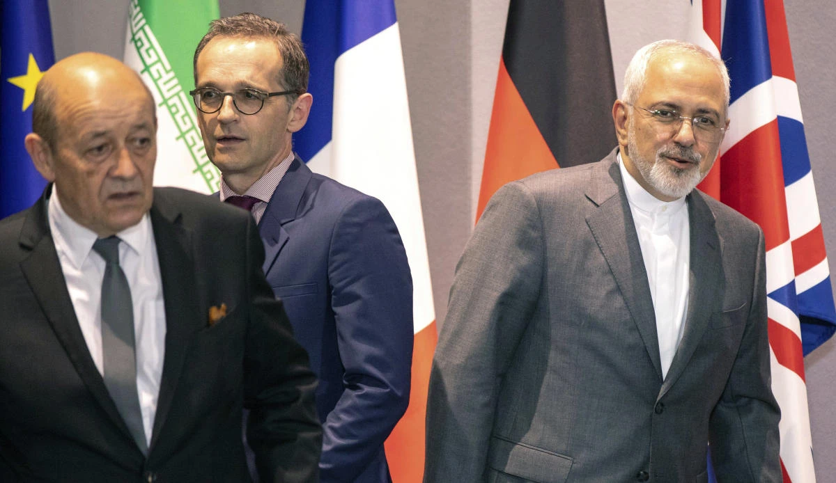 From left, French Foreign Minister Jean-Yves Le Drian, German Foreign Minister Heiko Maas and Iranian Foreign Minister Javad Zarif walk, during a meeting of the foreign ministers from Britain, France and Germany with the Iran Foreign Minister and EU foreign policy chief Federica Mogherini, at the Europa building in Brussels, Tuesday, May 15, 2018. (AP/Olivier Matthys, Pool)