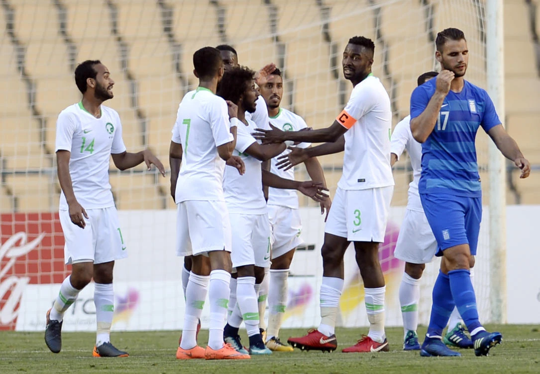 Salem Al-Dawsari (C) celebrates after scoring a goal during the friendly football match between Saudi Arabia and Greece at the Olympic stadium in Sevilla. (AFP)