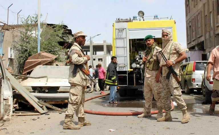 A picture taken on March 13, 2018 in the southern Yemeni city and government bastion of Aden shows government soldiers at the scene of an explosion from a suicide bombing claimed by the ISIS group which hit UAE-trained Yemeni troops. (AFP)