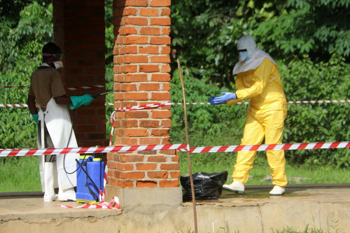 A health worker is sprayed with chlorine after visiting the isolation ward at Bikoro hospital, which received a new suspected Ebola case, in Bikoro, Democratic Republic of Congo May 12, 2018. (Reuters)