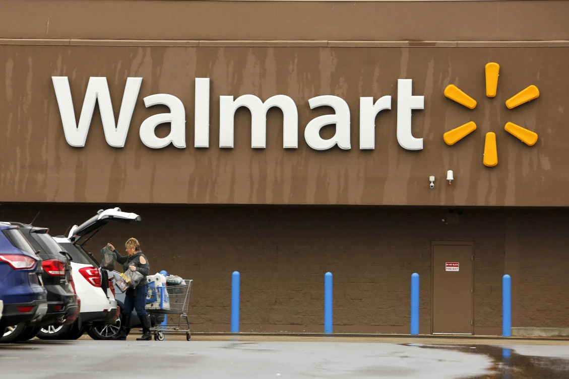A shopper loads her car after shopping at a Walmart in Pittsburgh. The company reported its earnings on Thursday, May 17, 2018. (AP Photo)