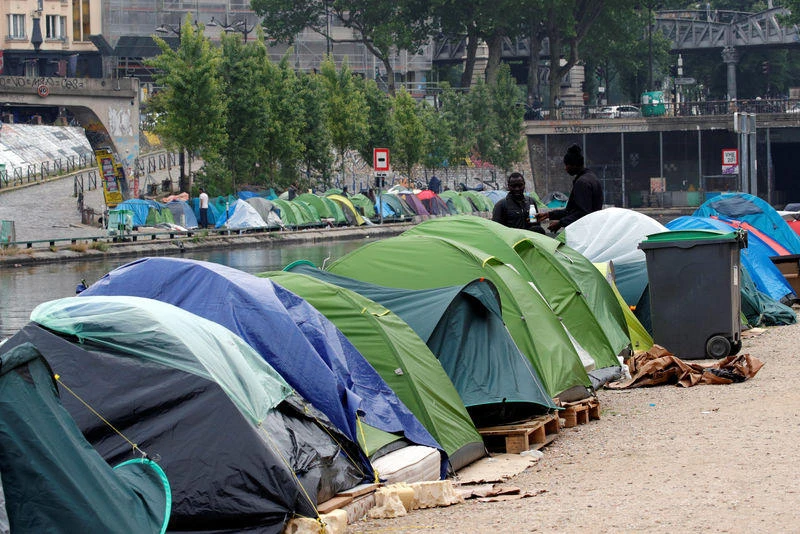 Migrant encampments on the banks of the Canal Saint-Martin in Paris. A young Afghan drowned in the canal last week. (Reuters)