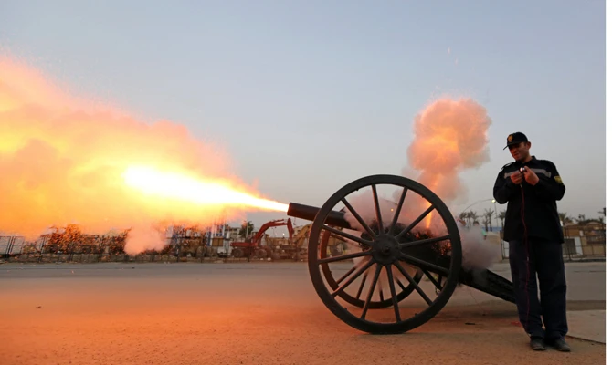 An Egyptian policeman in Cairo fires a cannon to announce the time to break fast during Ramadan. (REUTERS file photo)