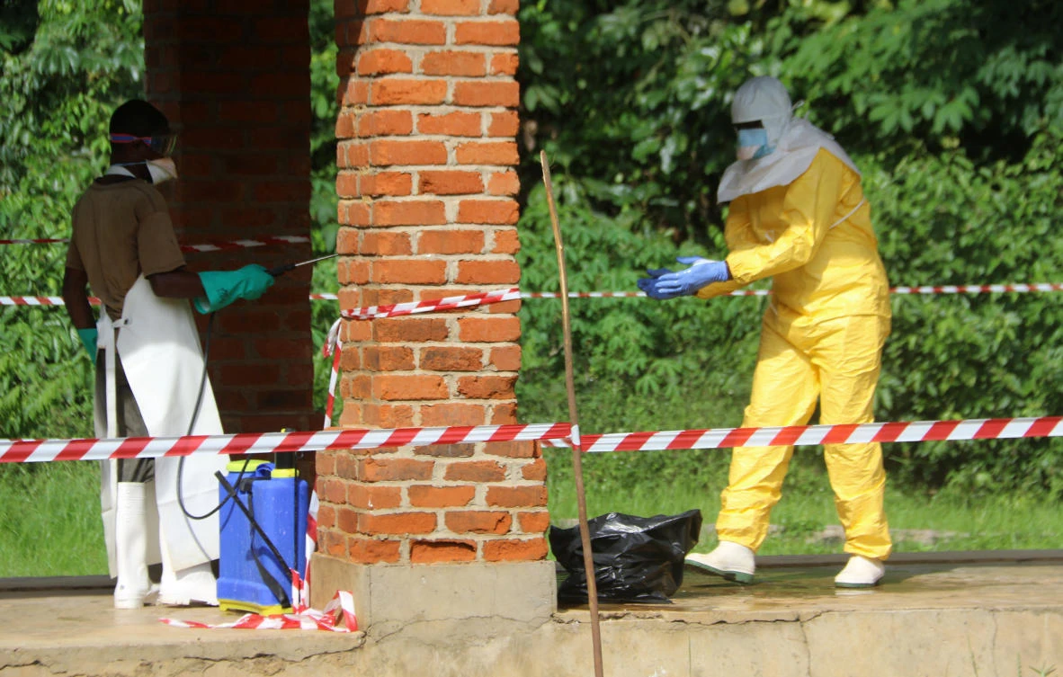 A health worker is sprayed with chlorine after visiting the isolation ward at Bikoro hospital, which received a new suspected Ebola case, in Bikoro, Congo. (Reuters)