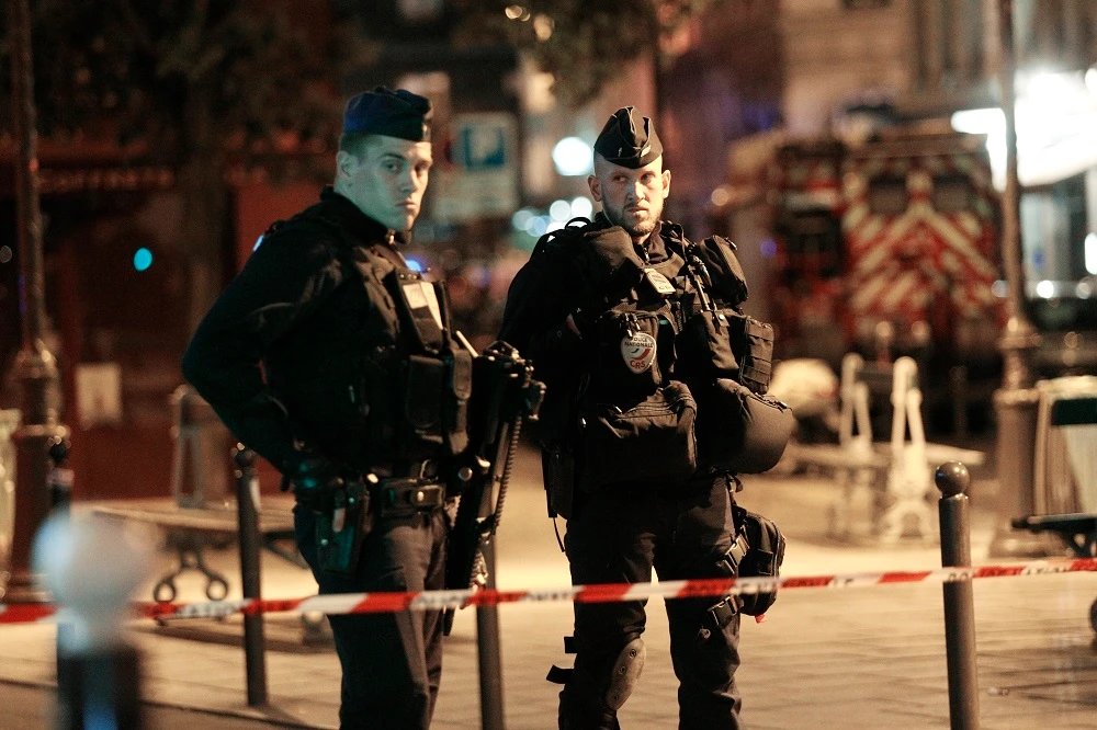 Policemen stand guard in a street of Paris centre after one person was killed and several injured by a man armed with a knife, who was shot dead by police in Paris on May 12, 2018. (AFP)