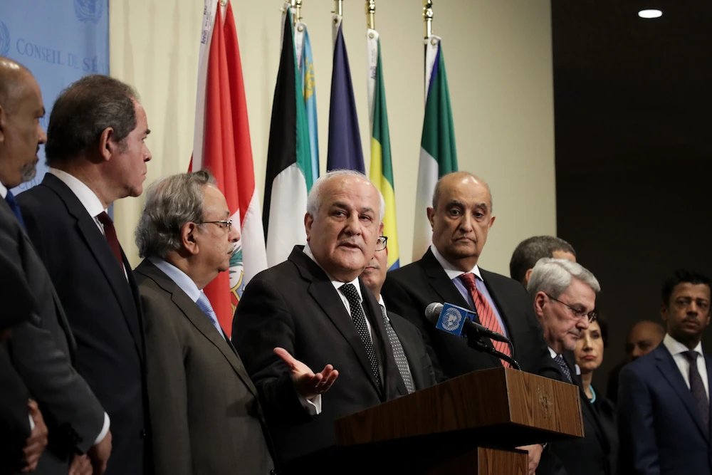 Surrounded by fellow Arab ambassadors to the United Nations, Permanent Observer of Palestine to the UN Riyad Mansour (C) speaks during a press briefing following a UN Security Council meeting concerning the violence at the border of Israel and the Gaza Strip, at United Nations headquarters, May 15, 2018 in New York City. (AFP)