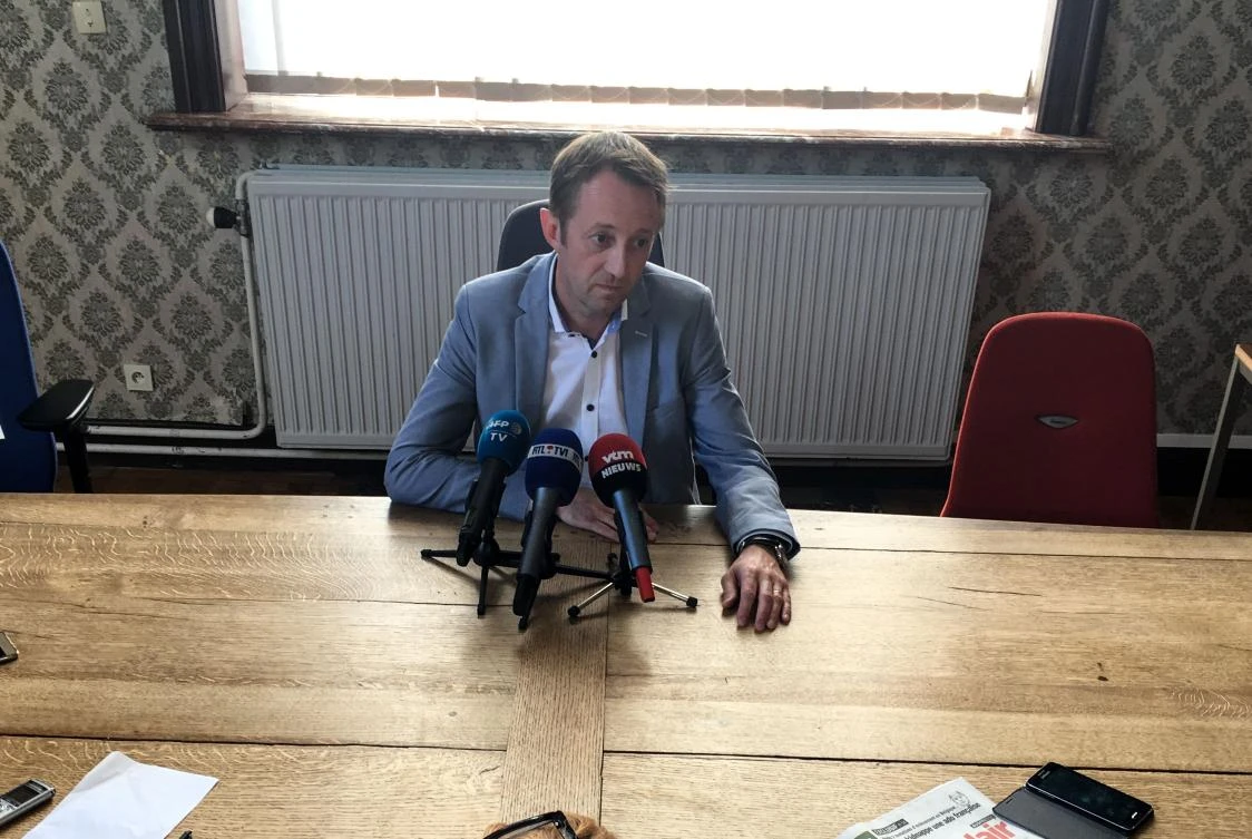 Mons' prosecutor Frederic Bariseau addresses a press conference on May 18, 2018 at the courthouse of Tournai after a two-year-old girl of Kurdish origin died after police gave chase to a van carrying illegal migrants in southern Belgium succumbed to a bullet wound. (AFP)