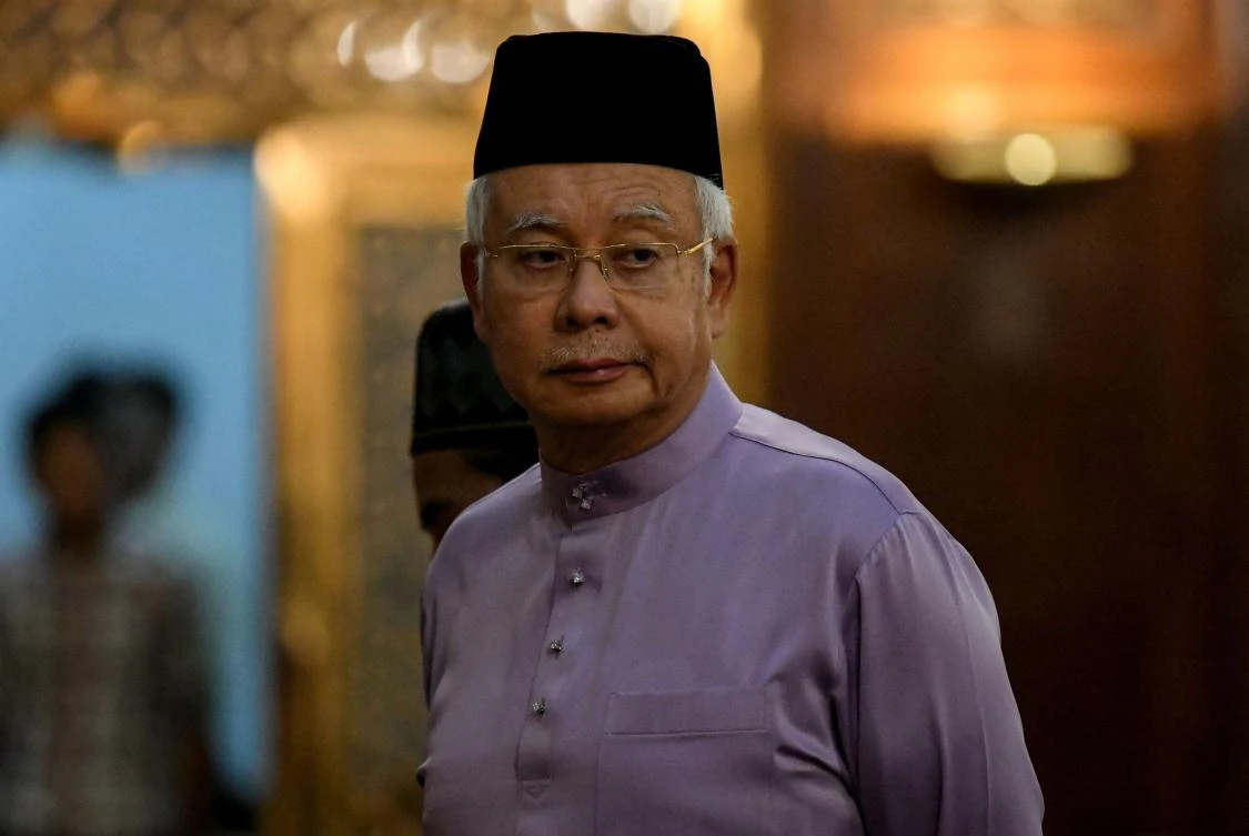 Malaysia's former prime minister Najib Razak waits to attend Friday prayers at the Barisan Nasional party headquarters in Kuala Lumpur on May 18, 2018. (AFP)
