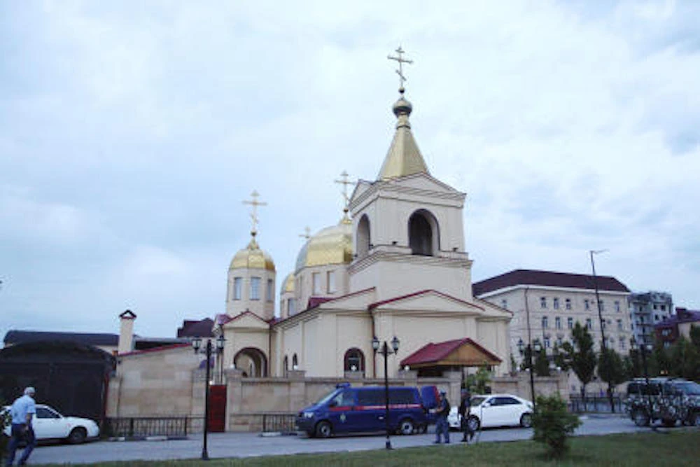 Policemen stand guard at Archangel Michael Church in Grozny, Russia, Saturday, May 19, 2018. (AP)