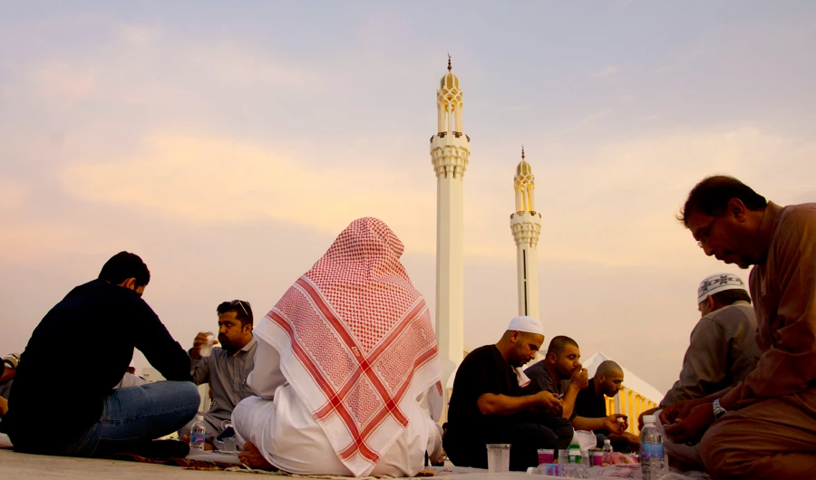 In this file photo, Saudis and residences break their fast at a mass free table donated to the poor marking the Muslim month of Ramadan in front of Hasan Anani Mosque in Jeddah, Saudi Arabia. (AP)