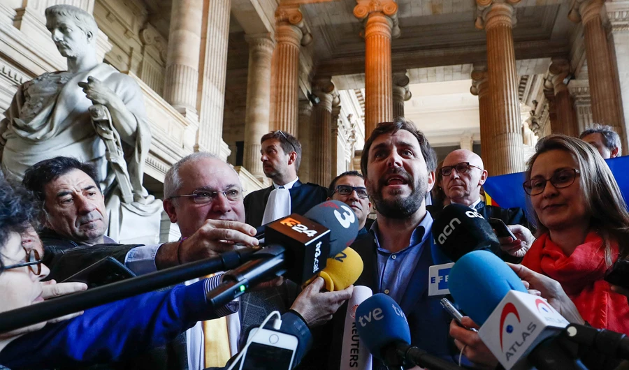 Dismissed former Catalan Minister of Culture Lluis Puig Gordi, regional Minister of Health Antoni Comin and regional Minister for Agriculture, Meritxell Serret talk to the media after appearing in court in Brussels, Belgium. (Reuters)