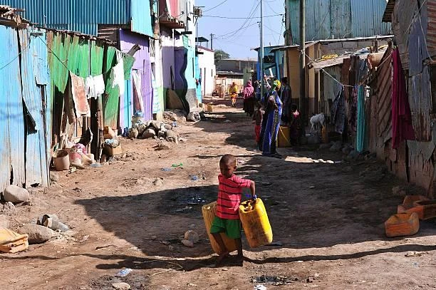 A Djiboutian boy carries water jerricans. Cyclone Sagar left two people dead in Djibouti’s capital and flooded several neighborhoods, affecting between 20,000 and 30,000 people. (AFP)