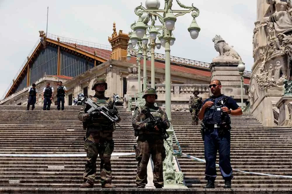 Police officials say a group of people, some armed with guns, shot into the air in the French city of Marseille and tried to corner officers. (REUTERS)