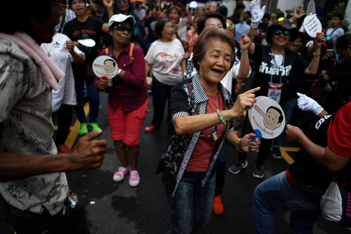 Anti-government protesters gather in Bangkok during a protest to demand that the military government hold a general election on Tuesday, May 22. (Reuters)