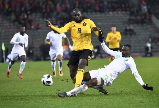 Motaz Hawsawi played against Romelu Lukaku in March. (AFP)