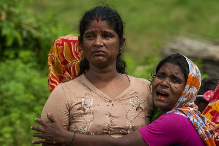 Hindu women cry near the bodies of their dead family members in Ye Baw Kyaw village, Maungdaw in Myanmar’s northern Rakhine state in this September 27, 2017 photo. (AFP)