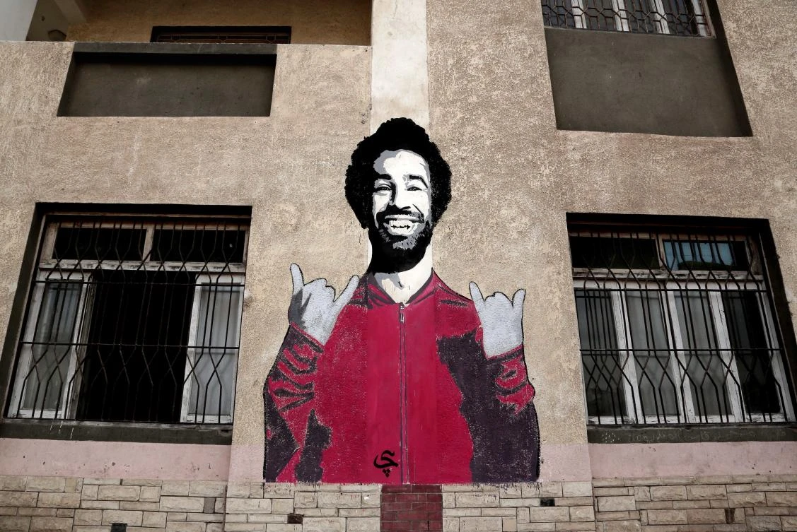 A sports and youth center in the Nile Delta village carries a wall mural of Mohamed Salah, the superstar who has enriched their lives. (AP)