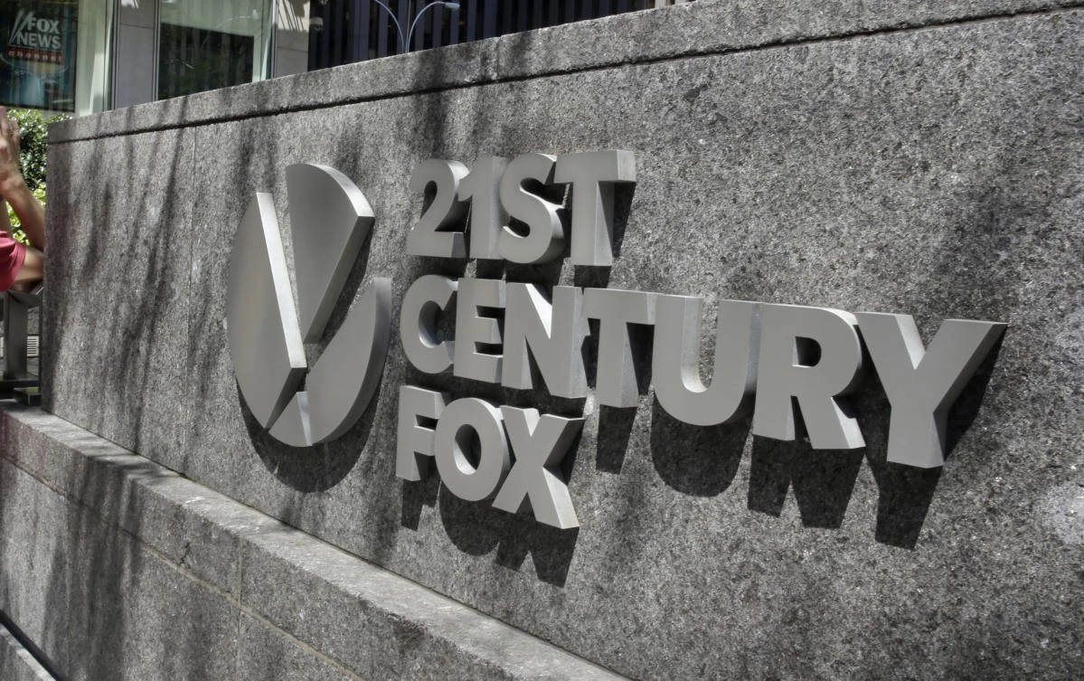 The Twenty-First Century Fox sign outside of the News Corporation headquarters building in New York. Comcast says it’s considering making an offer to buy Twenty-First Century Fox, which would put it in a head-to-head bidding fight with Disney. (AP)