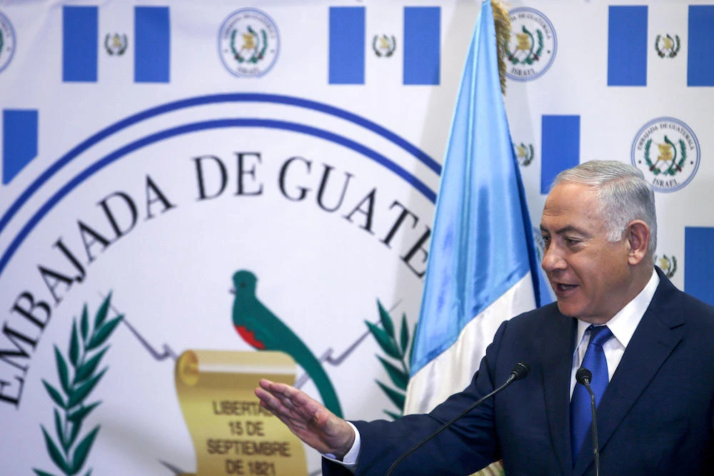 Israeli Prime Minister Benjamin Netanyahu speaks during the inauguration ceremony of the inauguration ceremony of Guatemala’s embassy in Jerusalem on May 16, 2018. Guatemala inaugurated its Israel embassy in Jerusalem on May 15, becoming the first country to follow in the footsteps of the United States’ deeply controversial move, breaking with decades of international consensus. (AFP)
