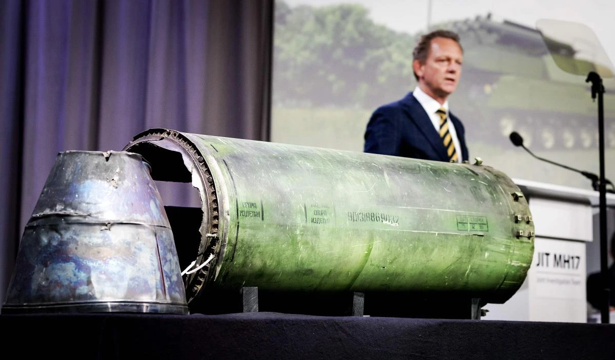 Head prosecutor Fred Westerbeke speaks next to a part of the BUK rocket that was fired on the Malaysia Airlines flight MH17 during the press conference of the Joint Investigation Team in Bunnik on Thursday, May 24. (ANP/AFP)