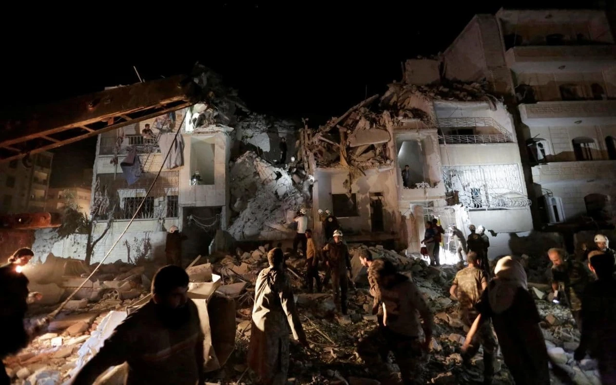 File photo showing airstrike survivors in Syria (Reuters)
