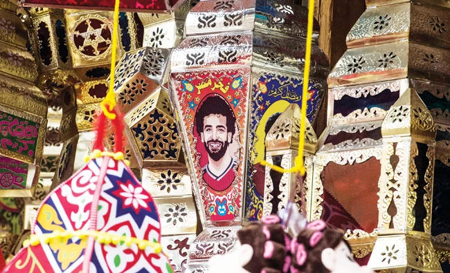 Ramadan lantern bearing the image of Liverpool's Egyptian midfielder Mohamed Salah hanging on sale at a market in Cairo's central Sayyida Zeinab district. AFP