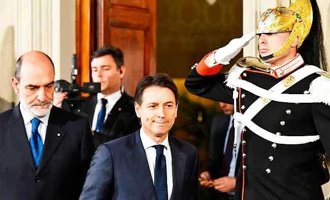 Italy's Prime minister candidate Giuseppe Conte (C) leaves after a meeting with Italy's President Sergio Mattarella on May 27, 2018 at the Quirinale presidential palace in Rome. (AFP)