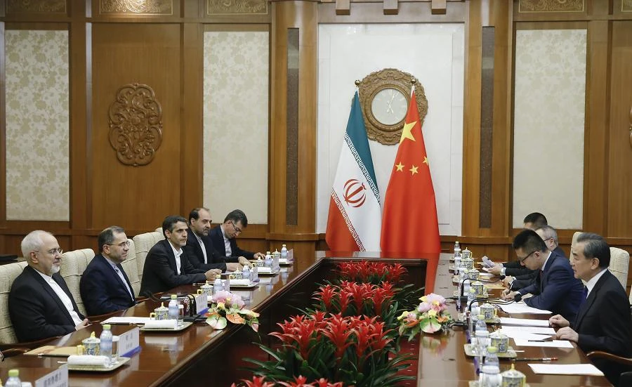 Chinese State Councillor and Foreign Minister Wang Yi (R) holds talks with Iranian Foreign Minister Mohammad Javad Zarif (L) at the Diaoyutai state guesthouse in Beijing on May 13, 2018. (AFP)