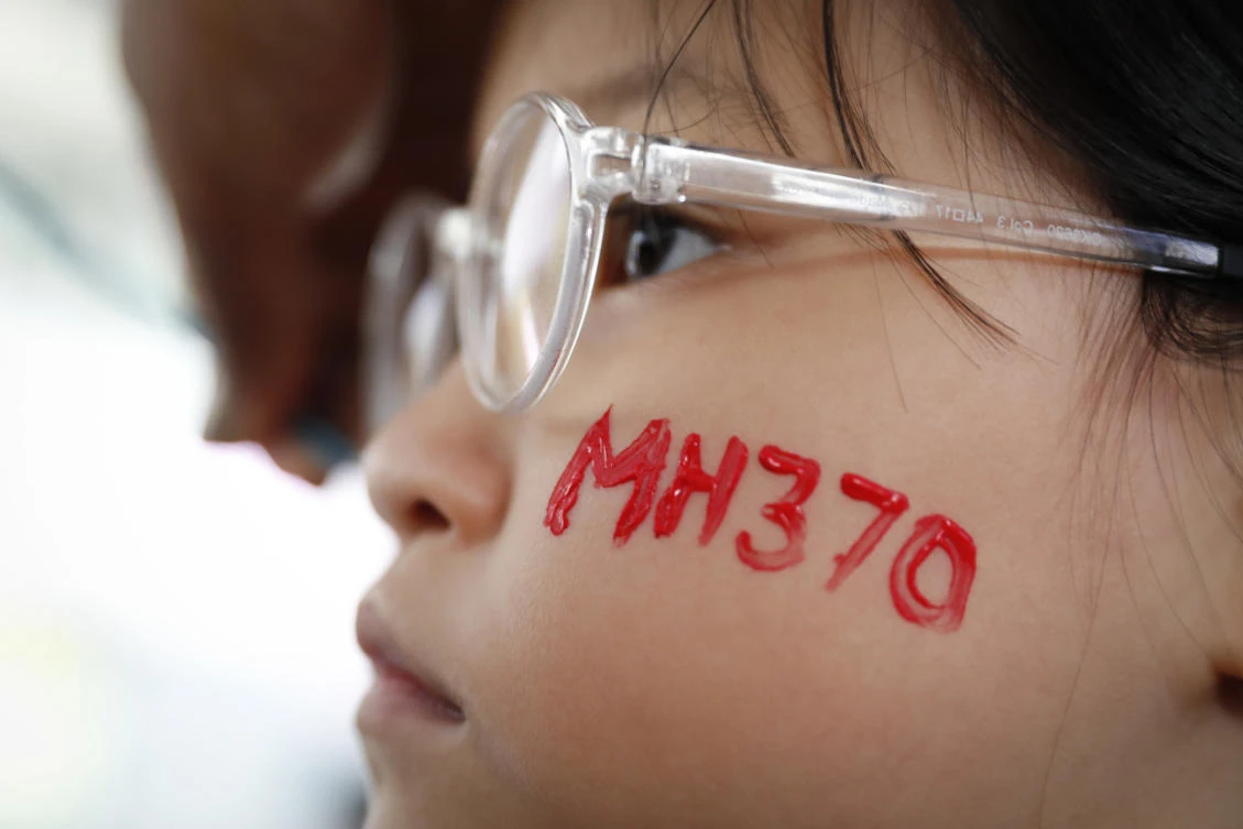 A girl has her face painted during the Day of Remembrance for MH370 event on March 30 in Kuala Lumpur. Australia, Malaysia and China agreed in 2016 that an official search would only resume if the three countries had credible evidence that identified a specific location for the wreckage. (AP)
