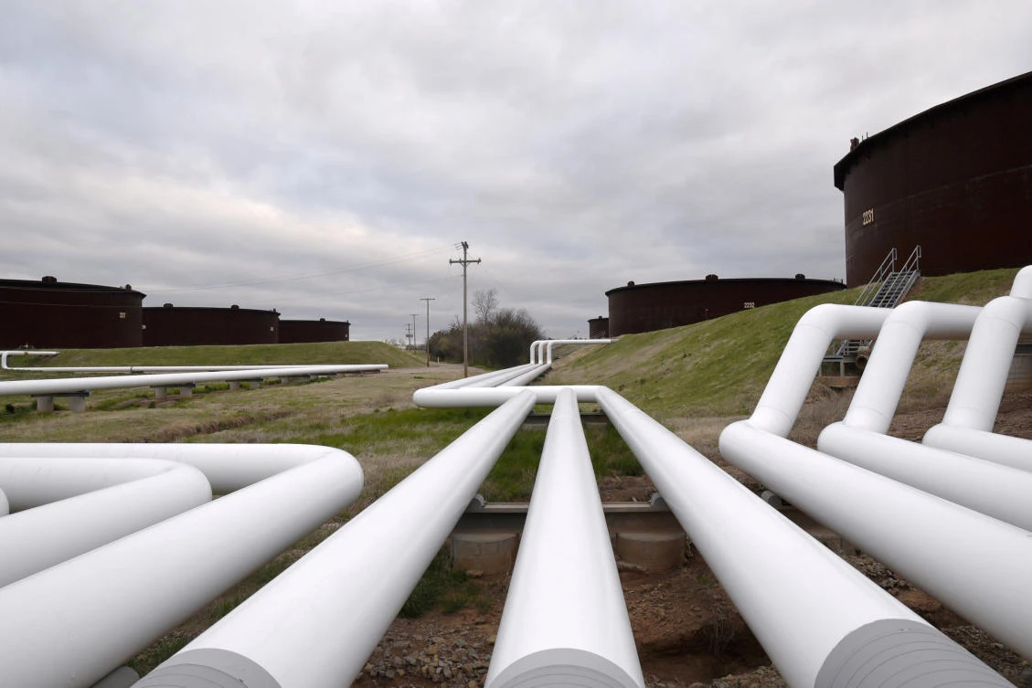 US oil production has surged by more than 27 percent in the last two years to 10.73 million barrels per day. Above, pipelines run to Enbridge’s crude oil storage tanks at their tank farm in Cushing, Oklahoma. (Reuters)