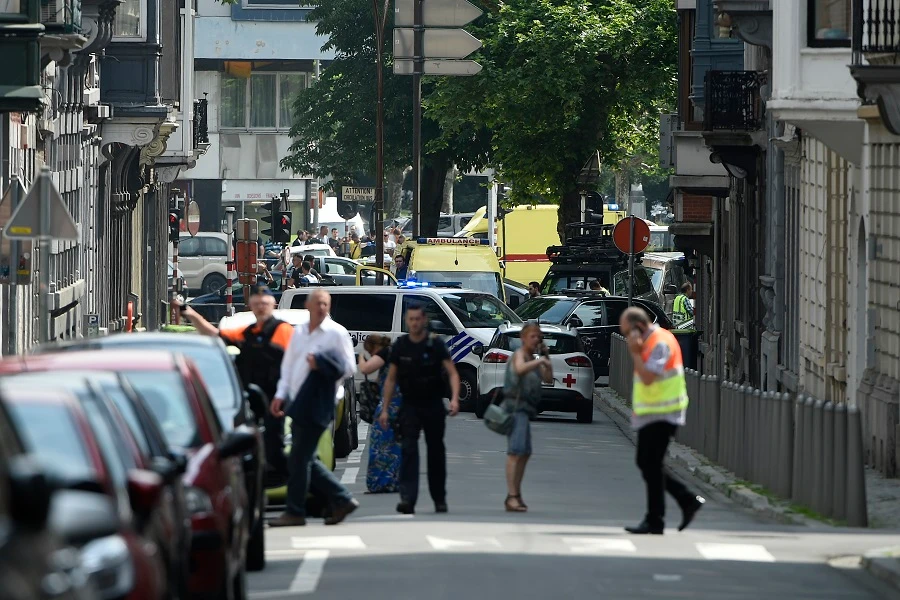 Police and ambulances are seen at the site where an armed man shot and killed police officers before being killed by police in the eastern Belgian city of Liege on May 29, 2018. (John Thys/AFP)