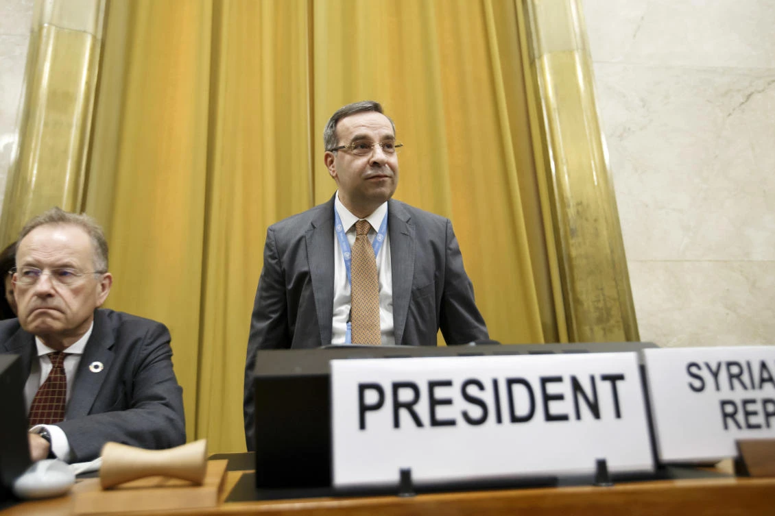 Syrian regime Ambassador Houssam-Eddin Ala, President of the Conference on Disarmament, stands next to Michael Moller, left, Director General of the United Nations Office at Geneva, prior to the opening of the Conference on Disarmament at the European headquarters of the United Nations in Geneva, Switzerland, May 29, 2018. (AP)