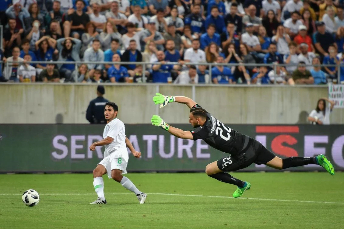 Yahya Al-Shehri scores his team's goal against Italy on Monday. (AFP)