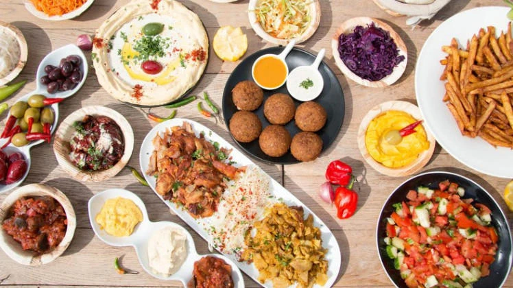 The evening meal known as iftar breaks the fast during the Muslim holy month of Ramadan and is often associated with environmentally-unfriendly excess, with tables groaning under the weight of heavy meat dishes. (Getty Images)