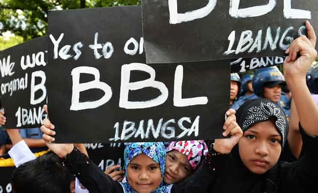 Children and youth during a rally in support of the peace accord between the government and MILF in Manila. Files/AFP