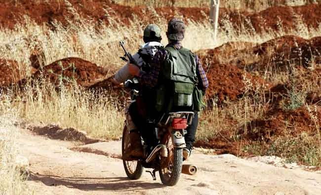 A fighter from the Free Syrian Army are seen in Yadouda area in Daraa, Syria on Tuesday, May 29, 2018. (REUTERS)