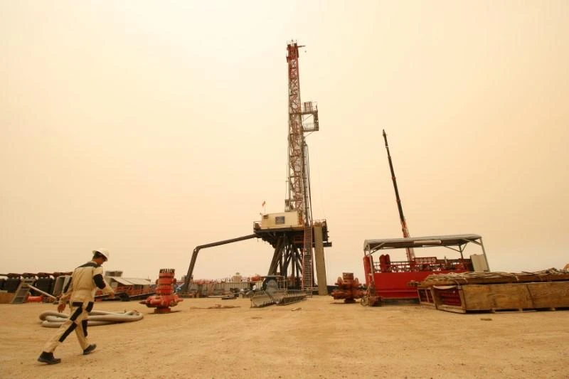 OPEC-led supply curbs have largely cleared an inventory surplus in industrialized countries, and stocks continue to decline. Above, a worker at the Sindbad oil field near the Iraqi-Iranian border in Basra, Iraq. (Reuters)