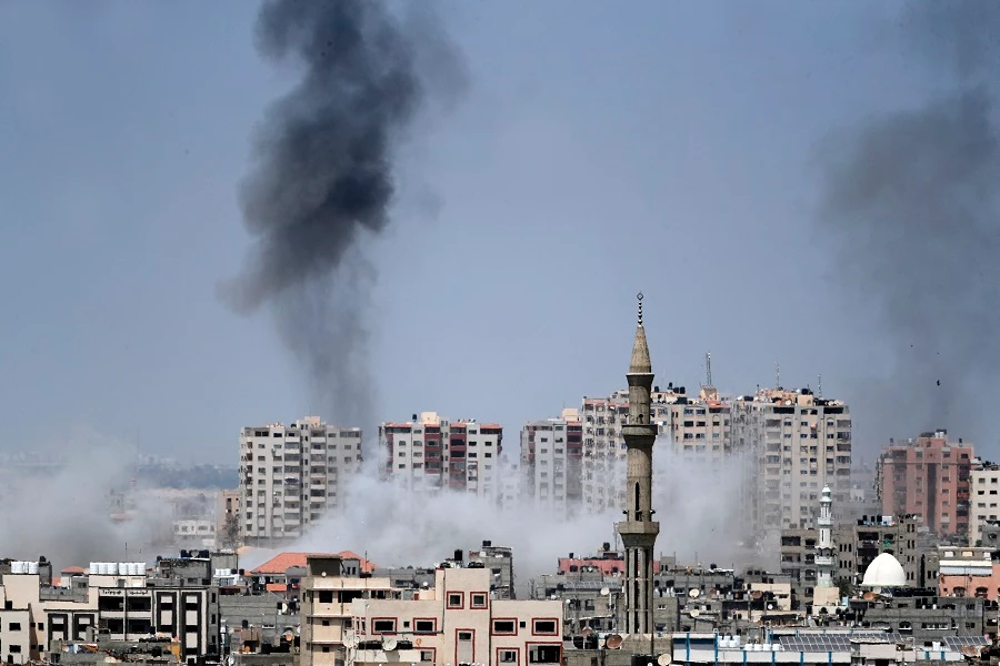 A photo taken from Gaza City on May 29, 2018, shows a smoke billowing in the background following an Israeli air strike on the Palestinian enclave. (AFP)