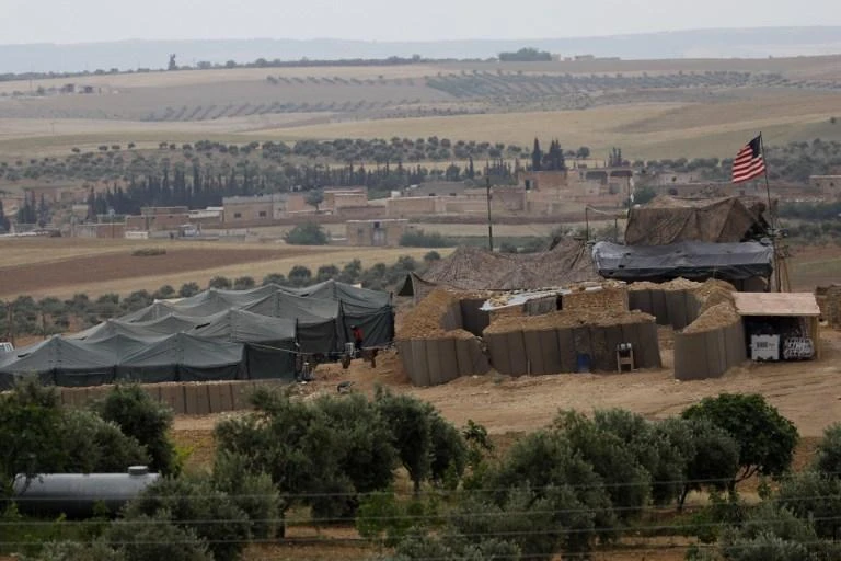 A picture taken on May 8, 2018 shows vehicles and structures of the US-backed coalition forces in the northern Syrian town of Manbij. The Syrian Observatory for Human Rights, a Britain-based monitor with sources on the ground, says around 350 members of the US-led coalition — mostly American troops — are stationed around Manbij. (AFP)