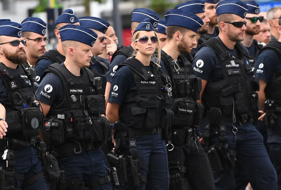 Liege police officers take part in a tribute ceremony for the victims of the Liege shootings. Two policewomen and a male bystander were killed in the attack. (AFP)