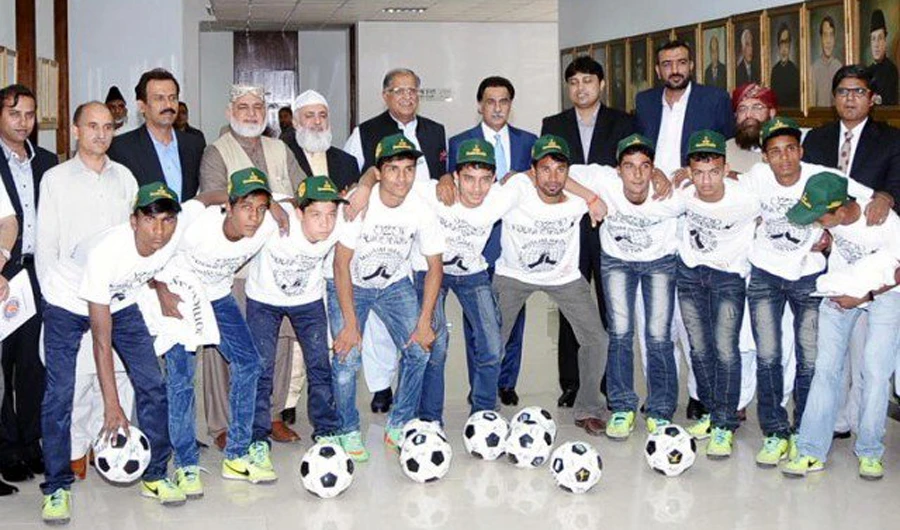 The National Assembly Speaker with Street Children Football Team at the Parliament House in Islamabad on May 14, 2014. (Press Information Department)